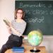 teacher-near-chalkboard-with-spanish-greeting 2